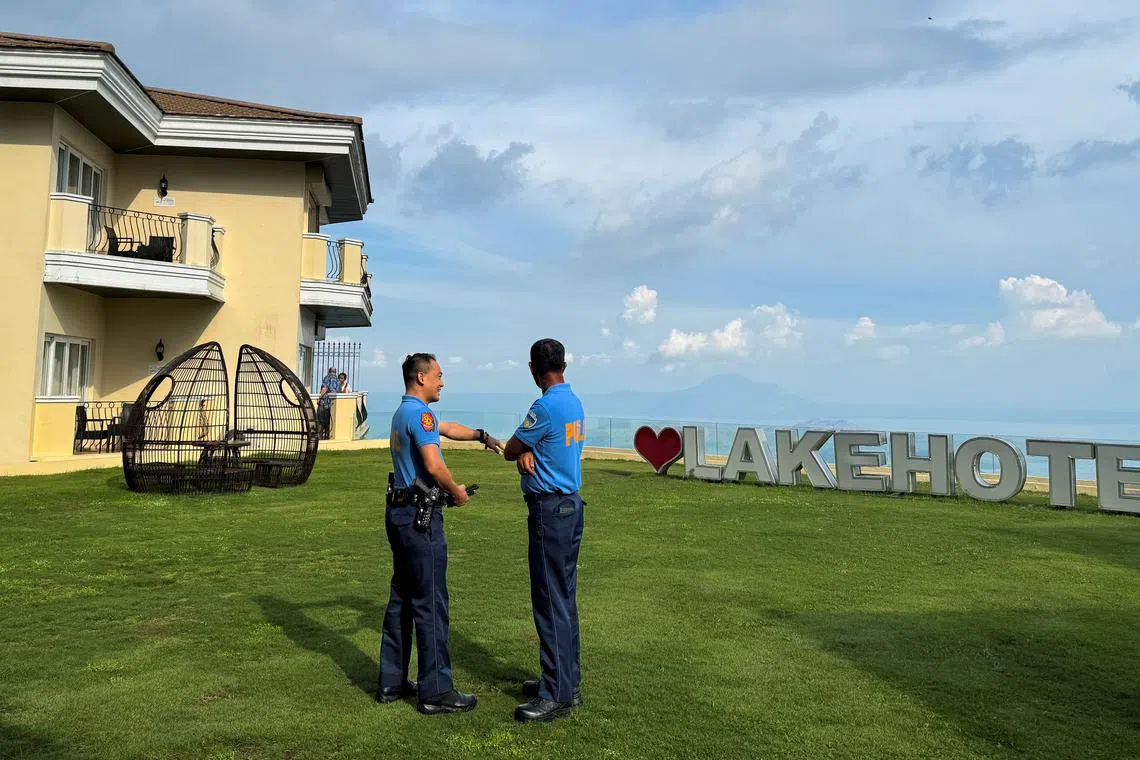 Police investigators stand along the courtyard of The Lake Hotel in Tagaytay City, Cavite Province, Philippines, July 12, 2024. REUTERS/Adrian Portugal