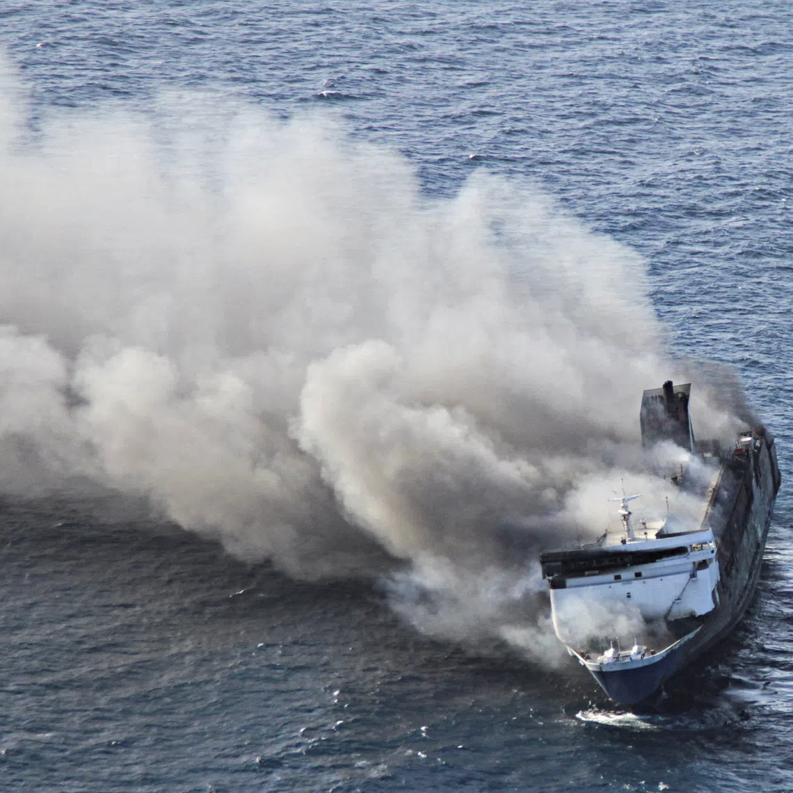 Plumes of smoke rise from a Mutiara Sentosa 2 ferry which caught fire off Indonesia’s Madura island on Aug 2.