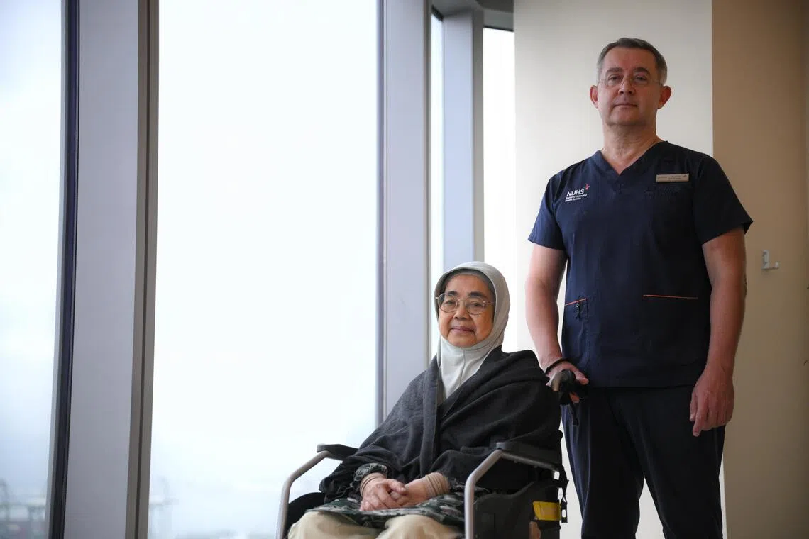 Sariah Mansoor (left), who survived an aortic dissection, with senior consultant Vitaly A. Sorokin at the National University Heart Centre, Singapore.