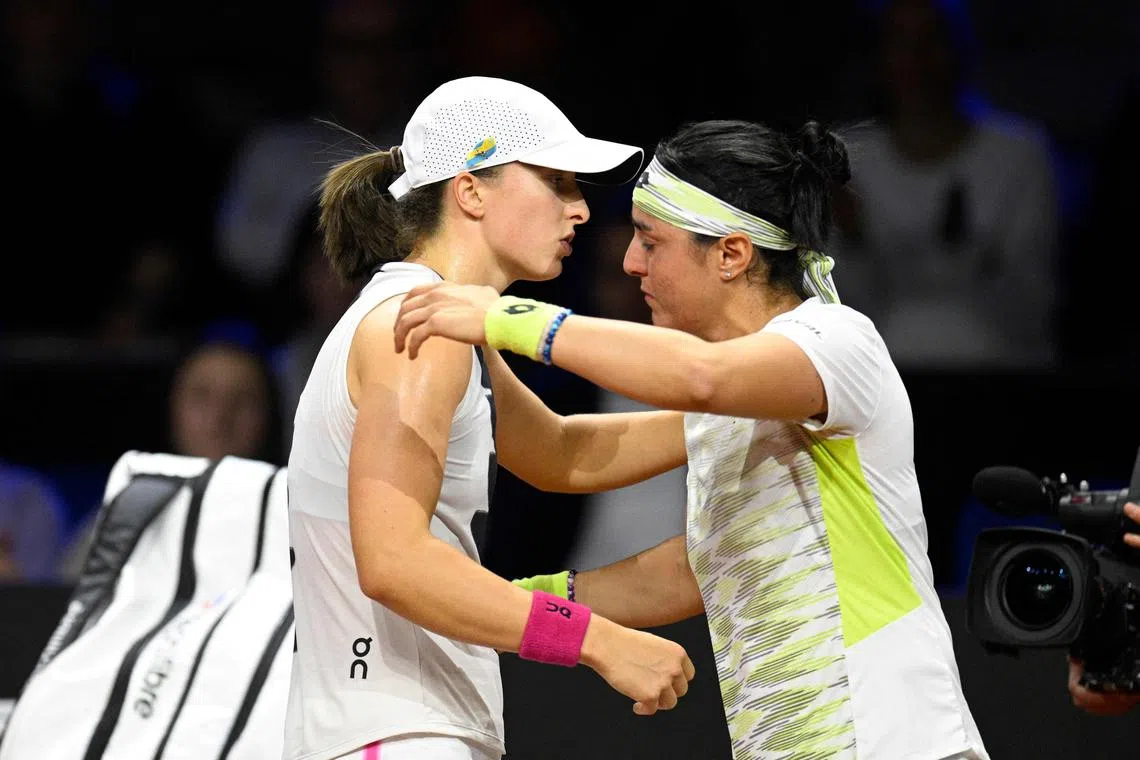 Poland's Iga Swiatek (left) and Tunisia's Ons Jabeur after the latter retired injured in the WTA Stuttgart Open on April 22, 2023.