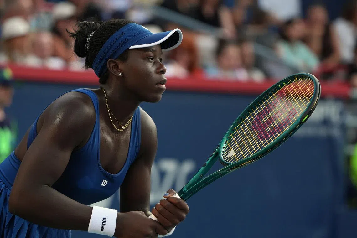 Aug 6, 2025; Montreal, QC, Canada; Victoria Mboko (CAN) returns the ball against Elena Rybakina (KAZ) in semifinal play at IGA Stadium. Mandatory Credit: Eric Bolte-Imagn Images