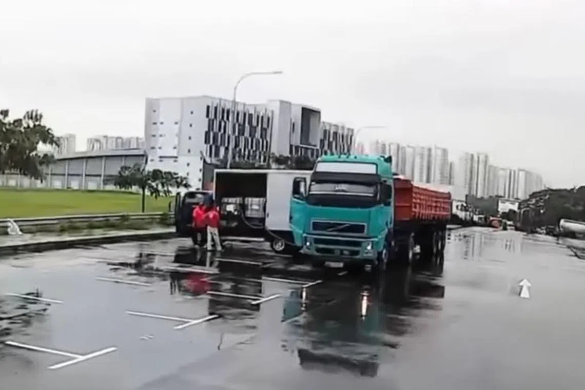 A Malaysian truck can be seen in a video transferring diesel to two containers, housed in a lorry.