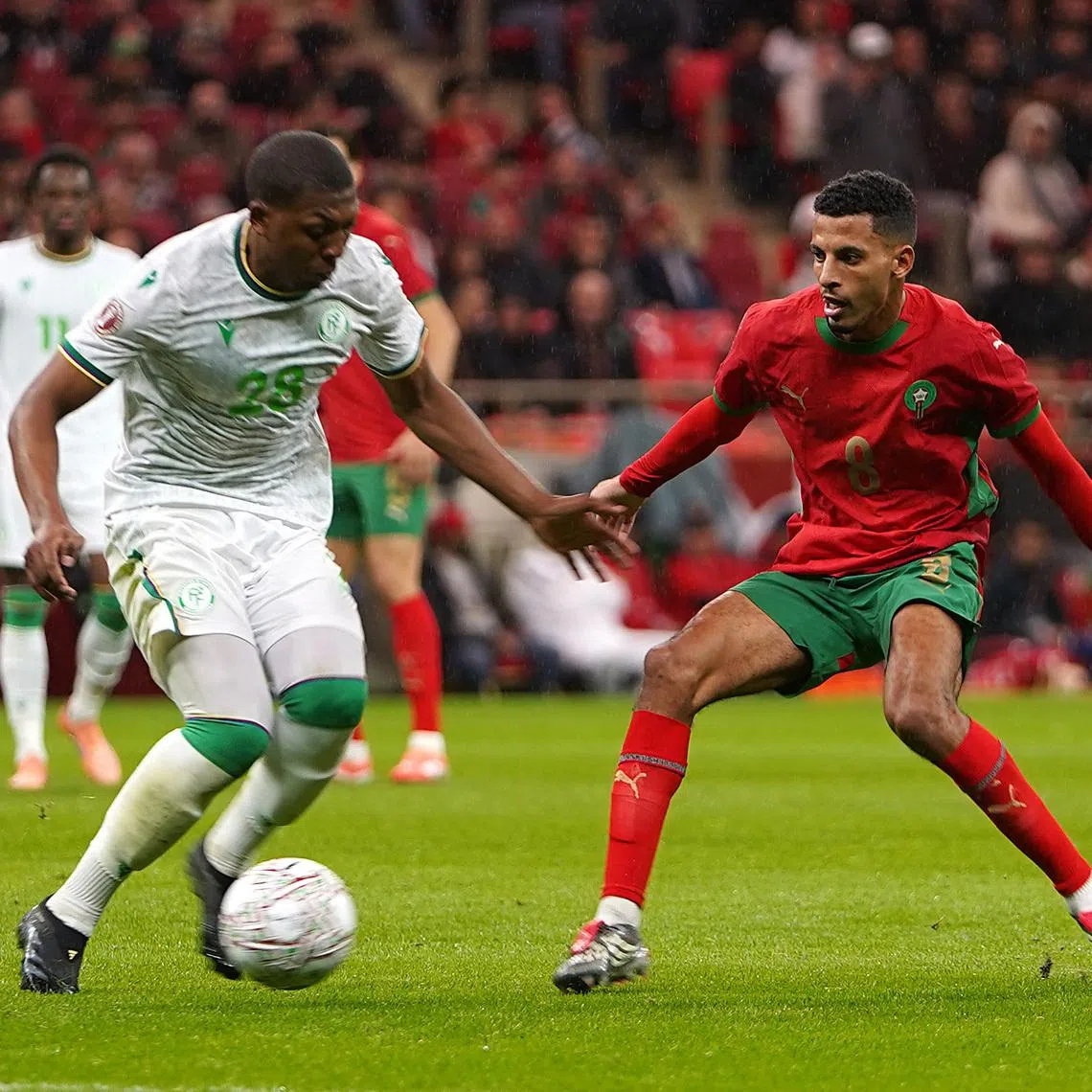 Soccer Football - CAF Africa Cup of Nations - Morocco 2025 - Group A - Morocco v Comoros - Prince Moulay Abdellah Stadium, Rabat, Morocco - December 21, 2025 Comoros' Zaydou Youssef in action with Morocco's Azzedine Ounahi REUTERS/Stringer