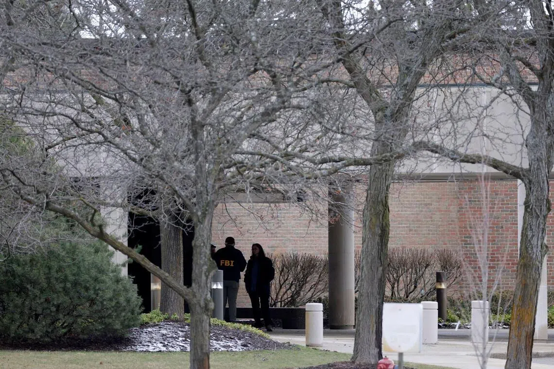 FBI agents are seen outside Temple Israel synagogue in West Bloomfield, Michigan, on March 13.