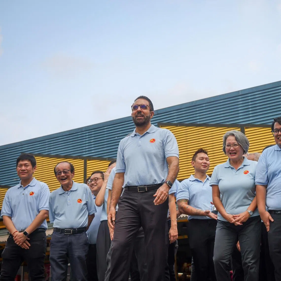 WP chief Pritam Singh at a walkabout with party members at Fengshan Centre on April 12.