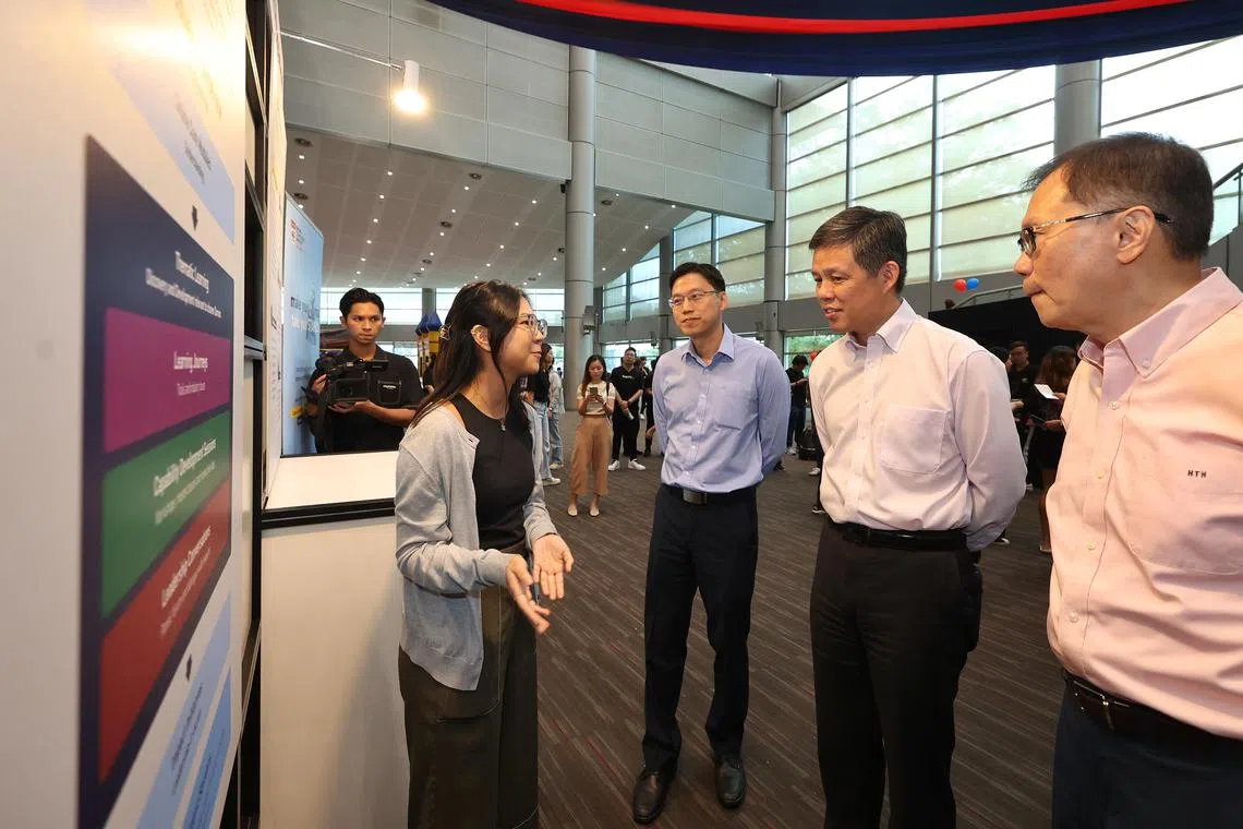 Minister for Education Chan Chun Sing speaking to an NTU student after the launch of NTU's new talent development programme.