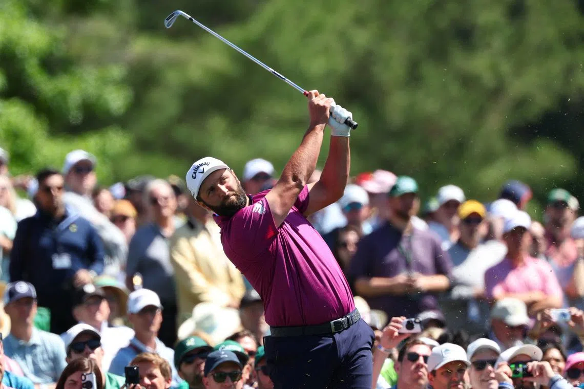 Golf - The Masters - Augusta National Golf Club, Augusta, Georgia, U.S. - April 8, 2025 Spain's Jon Rahm hits his tee shot on the 12th hole during a practice round REUTERS/Mike Segar