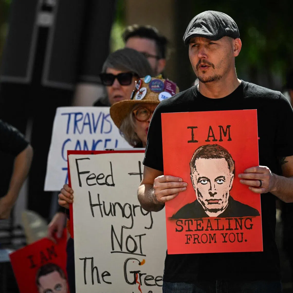 People protest during the 'No $1 Trillion for Elon Musk!' rally, at the Texas State Capitol, in Austin, on Nov 5. 