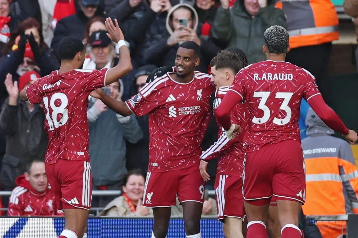 Alexander Isak (centre) celebrates scoring Liverpool’s 2-0 goal against Brighton & Hove Albion, in Liverpool, Britain, on Oct 25.