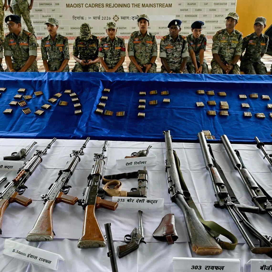 Weapons seized from Maoist rebels and fighters upon their surrender are displayed at a police facility in Dantewada in Chhattisgarh state's Bastar division on March 31.