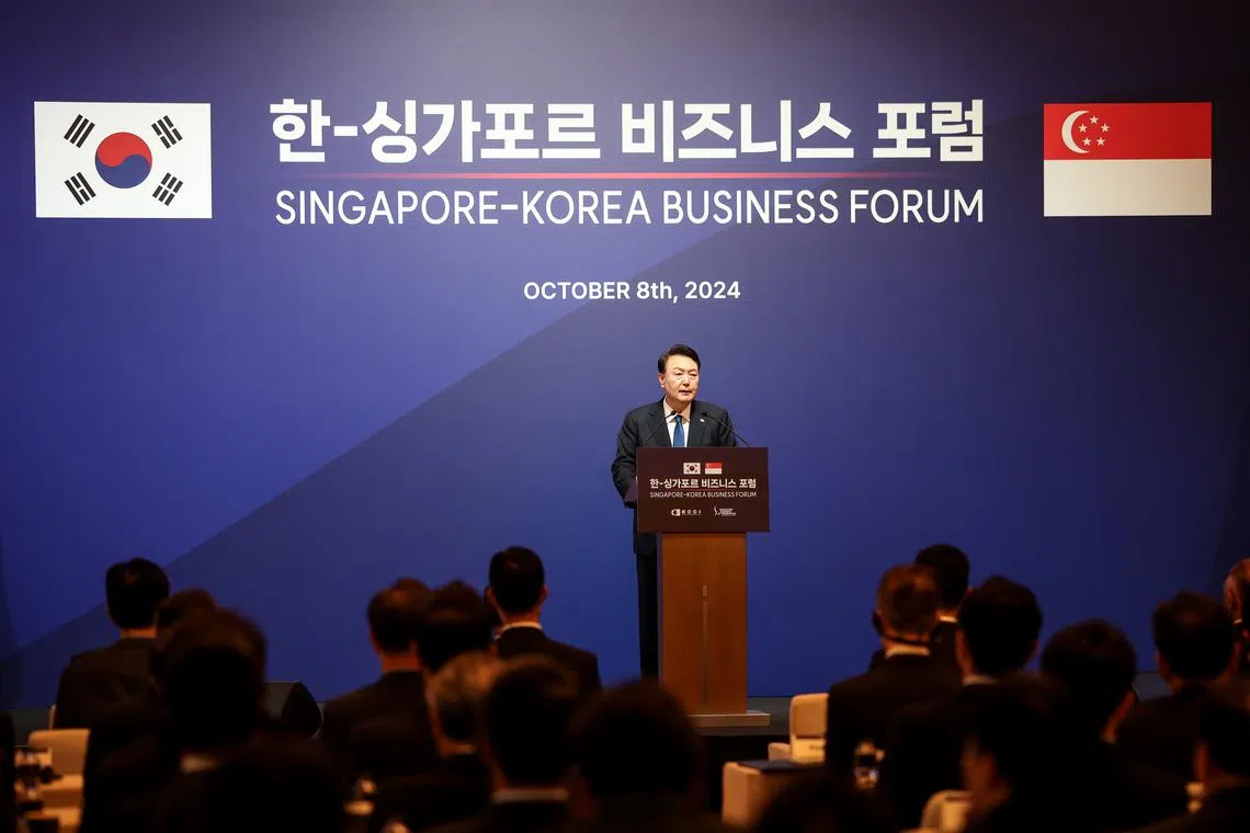 South Korean President Yoon Suk Yeol speaking at a business forum during his state visit to Singapore on Oct 8.