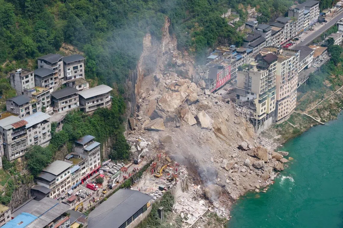 Rescue workers searching for survivors at the site of a landslide in Pengshui county in Chongqing, China, on July 17.