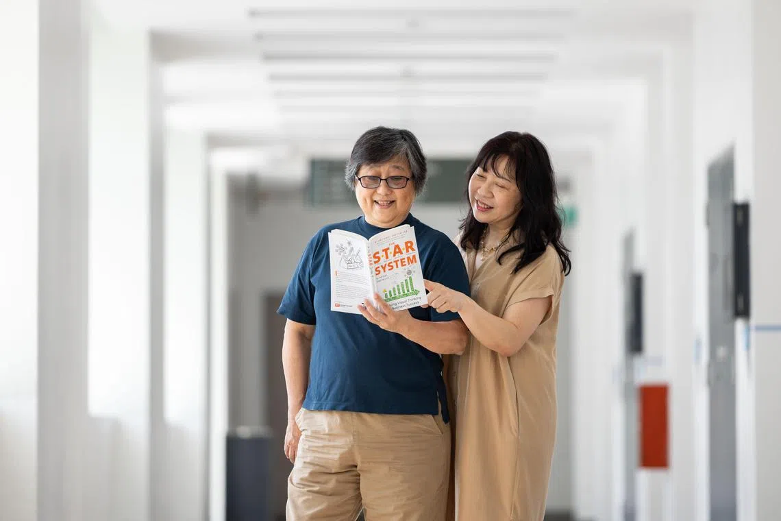 ST20240718_202460800733/syretire/Brian Teo/Stephanie Yeo GN/ (From Left) Co-authors Ms Ai Yat Goh, 68, and Ms Sherrie Low, 59, with their book, The STAR System: Applying Visual Thinking for Business Success, at the Singapore Institute of Management Campus on July 18, 2024. Their book was on The Straits Times' bestseller list for several weeks this year. ST PHOTO: BRIAN TEO.