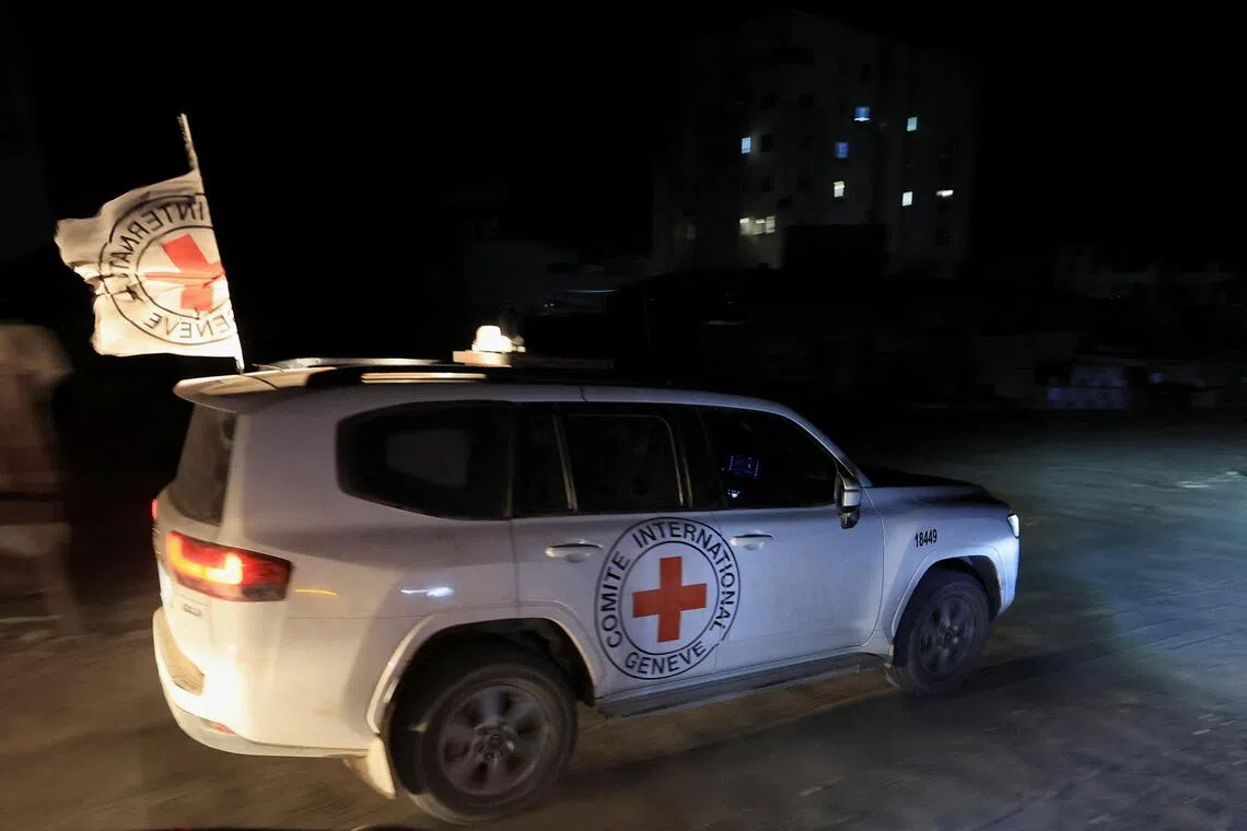 A Red Cross vehicle in Gaza City transporting the body of a deceased hostage on Oct 27.
