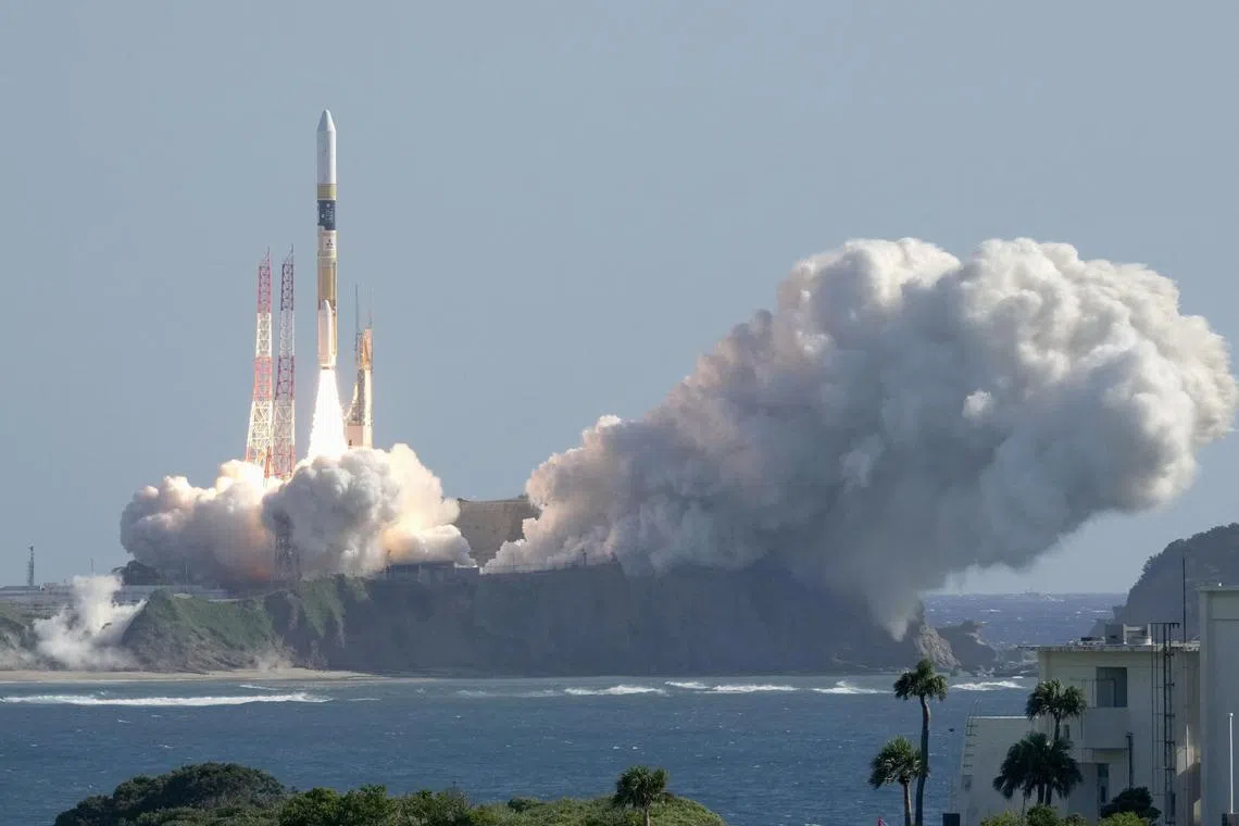 The H-IIA rocket carrying the national space agency's moon lander is launched at Tanegashima Space Center on Sept 7.