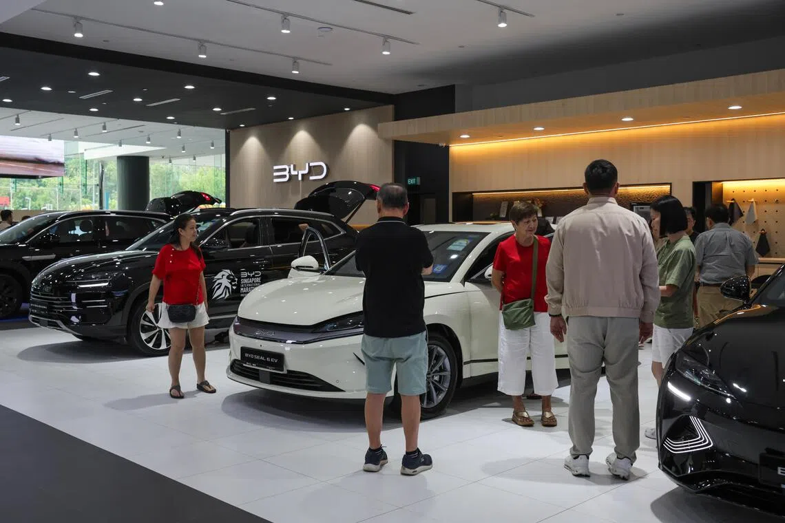 ST20261004_202697200432: Gin Tay/ ntcoe08/ Lee Nian Tjoe/ (Photos for upcoming COE-related stories) Vantage Automotive - Generic photo of shoppers at BYD showroom along Alexandra road on Oct 4, 2026.