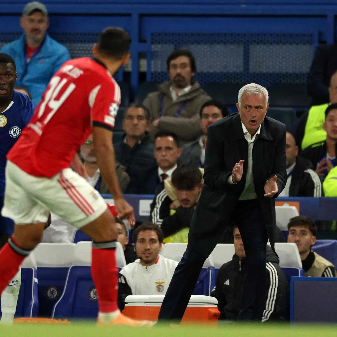 Benfica coach Jose Mourinho shouts instructions to his players from the touchline during the Champions League clash against his former side Chelsea.