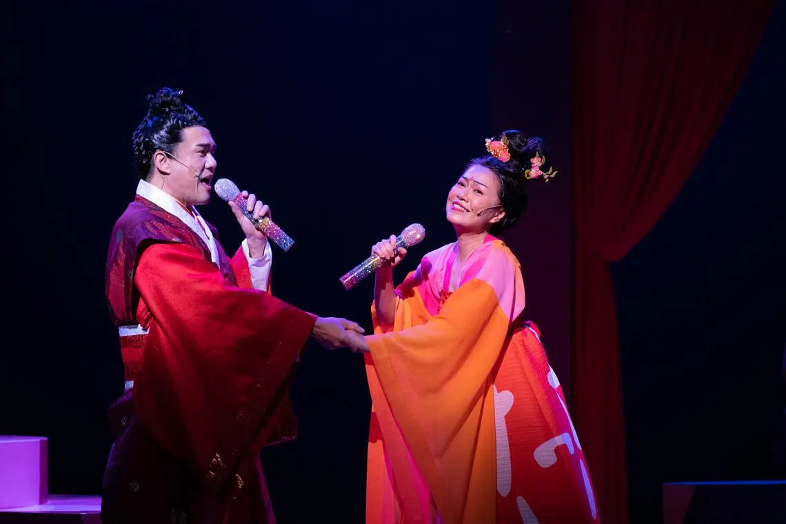 Joanna Dong plays Mei Ying, who waits faithfully for her husband Qiu Hu (Cavin Soh, left). 