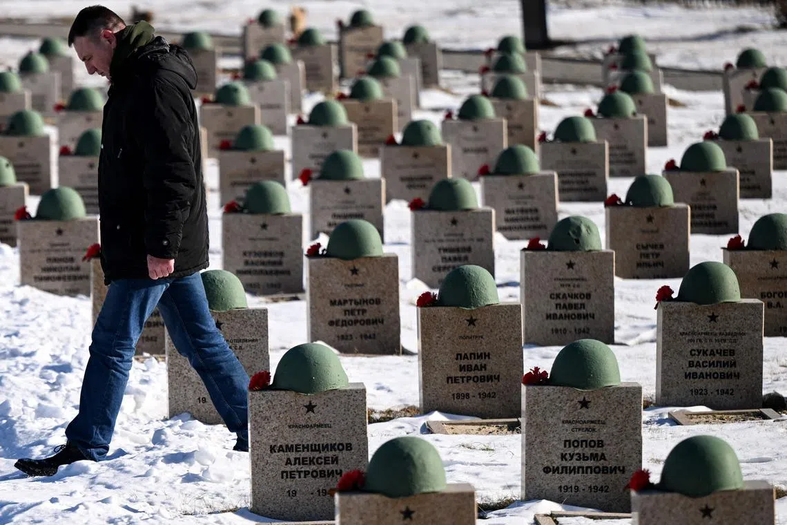 Searcher and volunteer Andrei Oreshkin walks at the Russian part of a memorial ground in the village of Rossoshka . The burial site for Soviet, German and Romanian soldiers and officers who died during the battle of Stalingrad, outside the Russia's southern city of Volgograd on Jan 24, 2023, ahead the 80th anniversary of the Stalingrad Battle. 