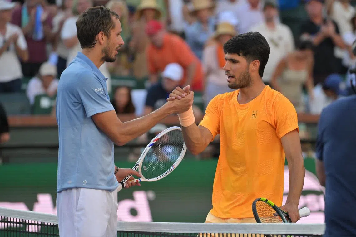 Mar 14, 2026; Indian Wells, CA, USA; Daniil Medvedev (RUS) shakes hands with Carlos Alcaraz (ESP) winning the semifinal match of the BNP Paribas Open at the Indian Wells Tennis Garden. Mandatory Credit: Jayne Kamin-Oncea-Imagn Images