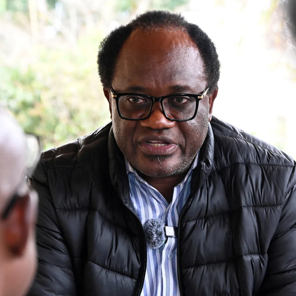 FILE PHOTO: Zambian opposition leader and National Reconciliation Party for Unity and Prosperity (NRPUP) presidential candidate Brian Muntayalwa Mundubile speaks to members of the media after casting his vote in Lusaka, Zambia, August 13, 2026. REUTERS/Moses Mwape/File Photo