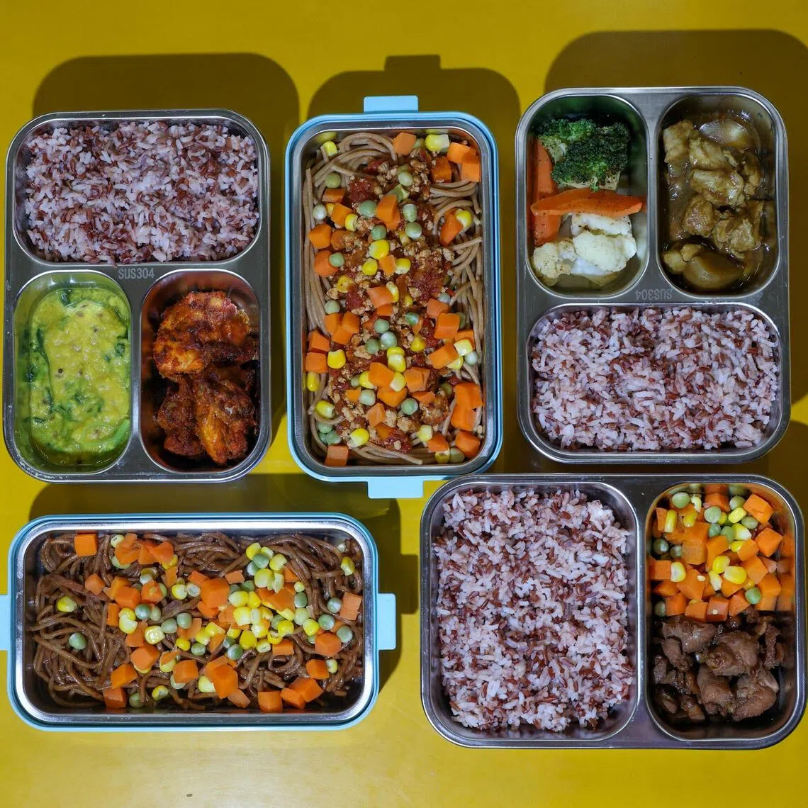 ST20250924_202593600459/smcanteen/Shermaine Ang/Jason Quah/
Bento meals for students prepared by Chang Cheng pictured Sep 24, 2025. ST PHOTO: JASON QUAH