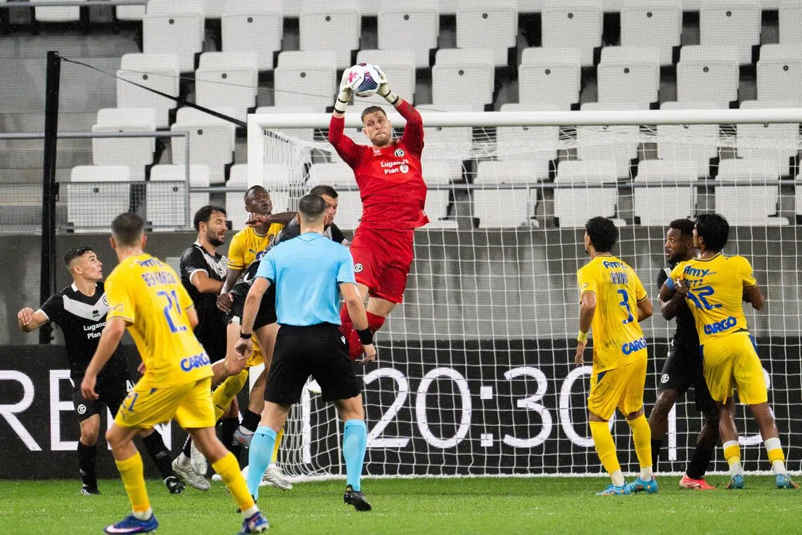 Goalkeeper David Von Ballmoos of Lugano in action during their 2-1 Conference League play-off, first-leg win over Maccabi Tel Aviv (in yellow) in Lugano, Switzerland, on Aug 20.