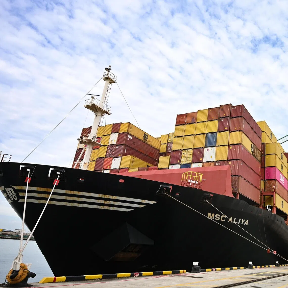 ST20251021-202526400572-Lim Yaohui-pixpsa/

MSC ALIYA container ship sailing under the flag of Liberia next to Double Trolley Quay Cranes at PSA Tuas Port on Oct 21, 2025.

PSA is expecting to move over all their operations at Tanjong Pagar, Keppel, and Brani Terminals to Tuas Port by 2027. Operations at Pasir Panjang Terminal will be consolidated at Tuas Port by 2040s. 

Tuas Port is currently the world’s largest fully automated container terminal and will have an annual handling capacity of 65 million TEUs when it’s fully completed in the 2040s.

Automated equipment and integrated operations systems will be deployed to operate this next generation port. The first set of berths at Tuas Port Phase 1 have started operations since 2021.

Can be used for stories on PSA, port, ship, economy, container, terminal, trade, berth, budget, transshipment, supply chain, operator, business, money, property, land, finance, and financial, maritime, supply chain, port operator, shipping, export, trade war, recession, tariff and transportation.

(ST PHOTO: LIM YAOHUI)