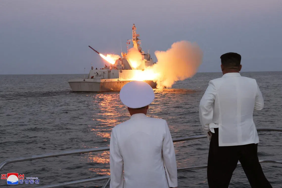 North Korean leader Kim Jong Un oversees a strategic cruise missile test aboard a navy warship.