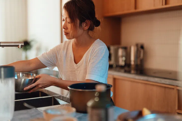 Housewife cooking in the kitchen.