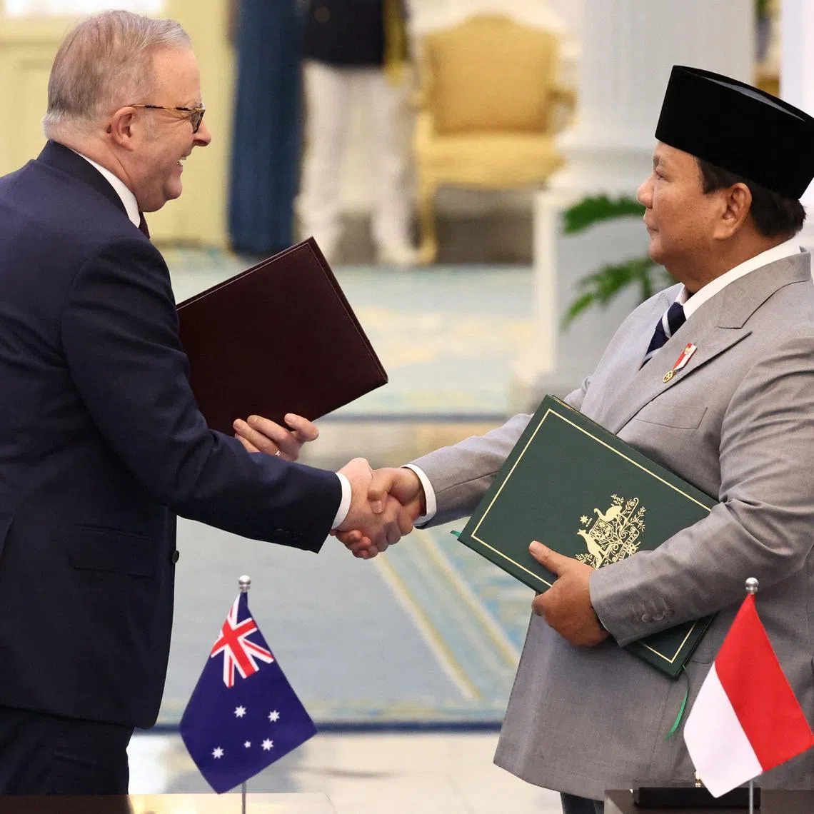 Australian Prime Minister Anthony Albanese shakes hands with Indonesian President Prabowo Subianto during a signing ceremony on a security agreement between the two countries, following their meeting at the Merdeka Palace in Jakarta, Indonesia, February 6, 2026. REUTERS/Willy Kurniawan