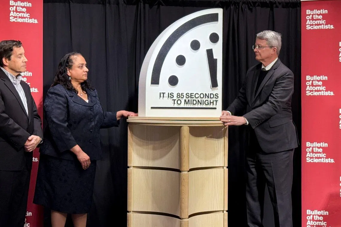 Jon Wolfsthal, director of global risk at the Federation of American Scientists (FAS), Asha George, executive director of the Bipartisan Commission on Biodefense, and Steve Fetter, professor of public policy and former dean at the University of Maryland, reveal the location of the minute hand on its Doomsday Clock, indicating what world developments mean for the perceived likelihood of nuclear catastrophe, during a town-hall in Washington, D.C., U.S., January 23, 2026. REUTERS/Kevin Fogarty