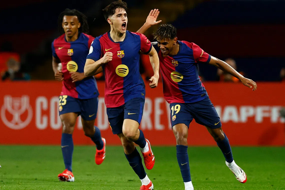 Soccer Football - Copa del Rey - Semi Final - First Leg - FC Barcelona v Atletico Madrid - Estadi Olimpic Lluis Companys, Barcelona, Spain - February 25, 2025 FC Barcelona's Pau Cubarsi celebrates scoring their second goal with Lamine Yamal REUTERS/Albert Gea