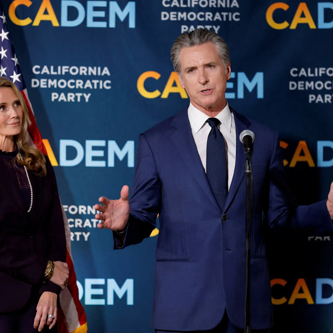 California's Governor Gavin Newsom speaks next to his wife Jennifer Siebel Newsom after California's special election on Proposition 50, a measure that would temporarily redraw congressional districts, in Sacramento, California, U.S., November 4, 2025. REUTERS/Fred Greaves