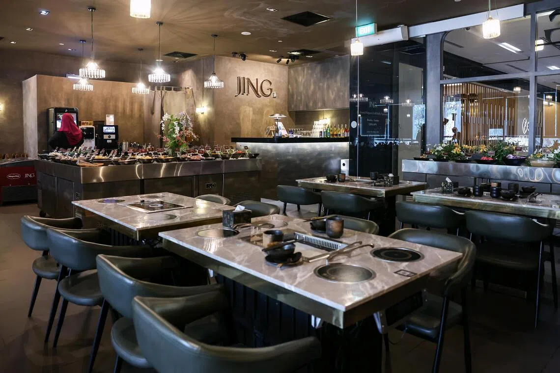 JING Hotpot and Grill adapted the traditional Chinese hotpot – centred on communal dining from a shared pot – into individual hotpots paired with a buffet spread while retaining a social element through a shared grill table.