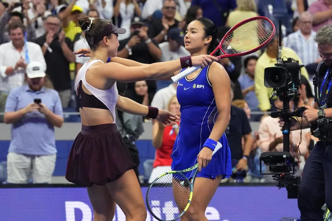 Iva Jovic of the US embraces Philippines’ Alexandra Eala after winning their US Open third-round match.