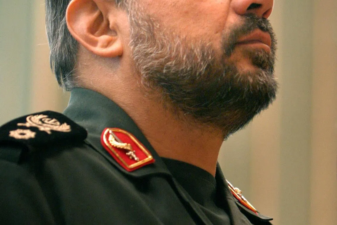 FILE PHOTO: Iran's Deputy Revolutionary Guards Commander Mohammad Baqer Zolqadr stands at attention during the playing of the national anthem at an anti-U.S. conference called \"The world without America\" in Tehran, Iran November 8, 2004. REUTERS/Raheb Homavandi/File Photo