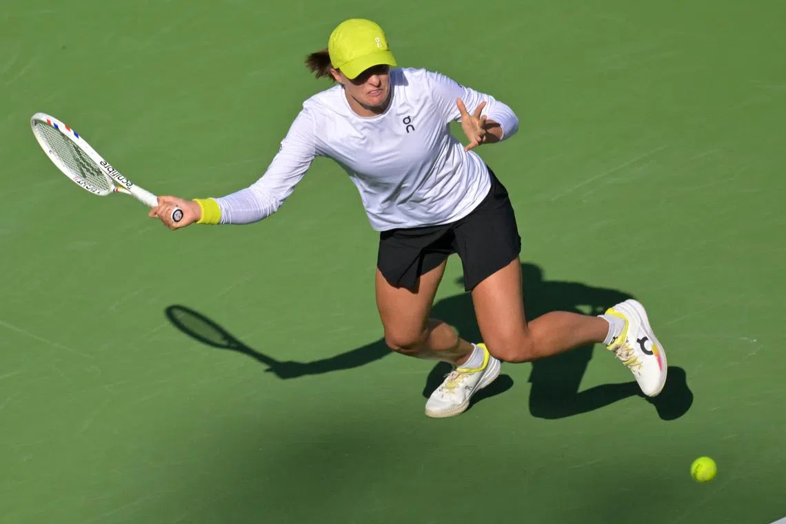 FILE PHOTO: Mar 14, 2025; Indian Wells, CA, USA;  Iga Swiatek (POL) hits a shot against Mirra Andreeva (not pictured) during the semifinal match at the BNP Paribas Open at the Indian Well Tennis Garden. Mandatory Credit: Jayne Kamin-Oncea-Imagn Images/File Photo