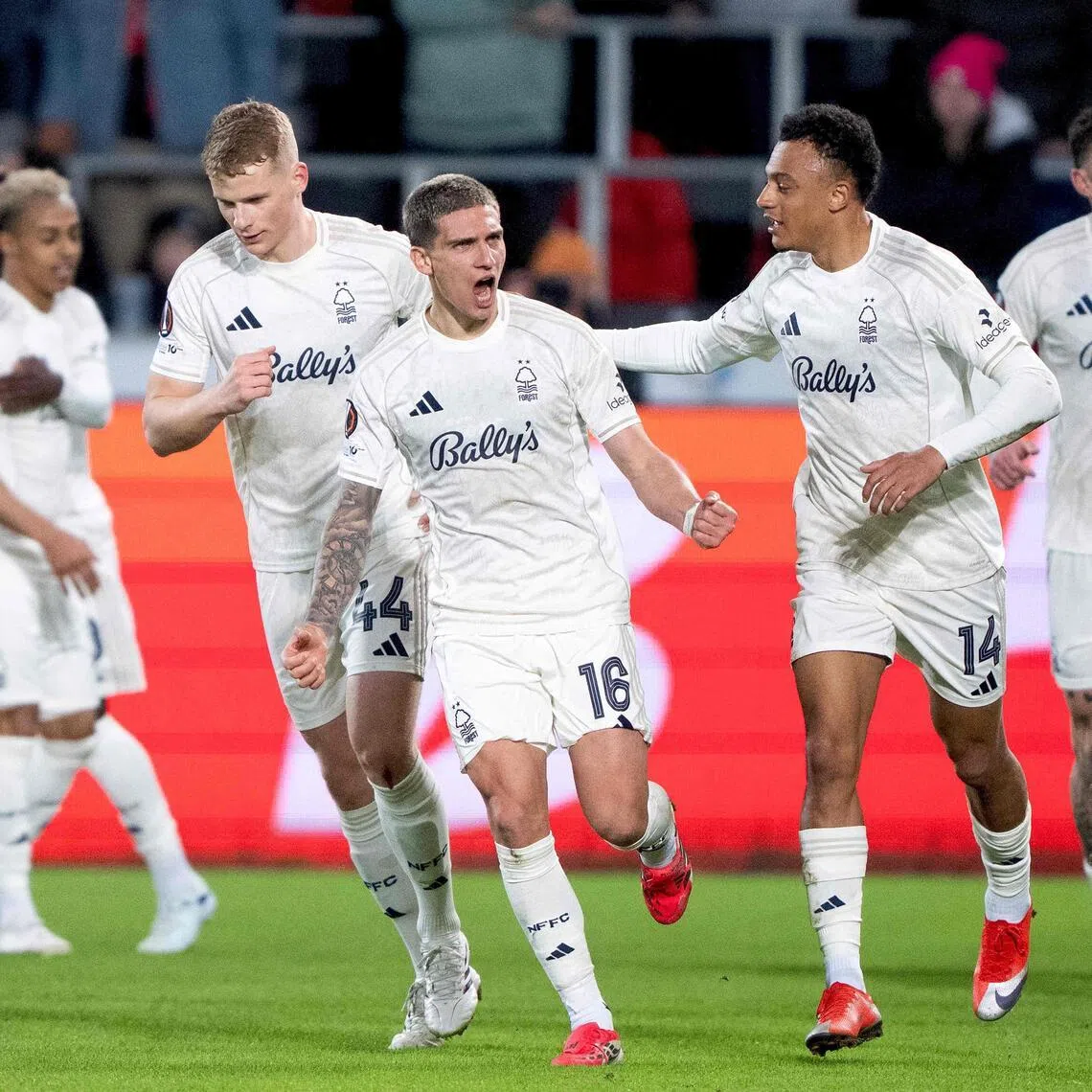 Nottingham Forest's Nicolas Dominguez celebrates scoring their first goal with teammates.