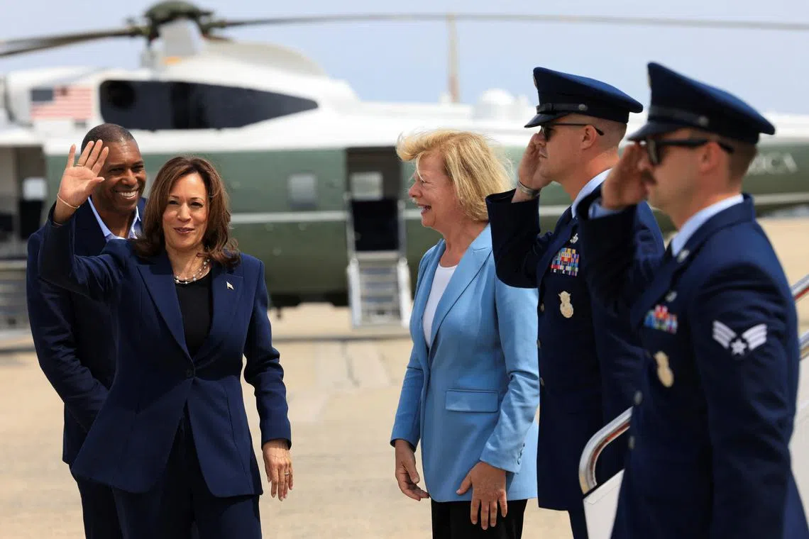 U.S. Vice President Kamala Harris waves before boarding Air Force Two as she departs on campaign travel to Milwaukee, Wisconsin, at Joint Base Andrews, Maryland, U.S., July 23, 2024. REUTERS/Kevin Mohatt/Pool