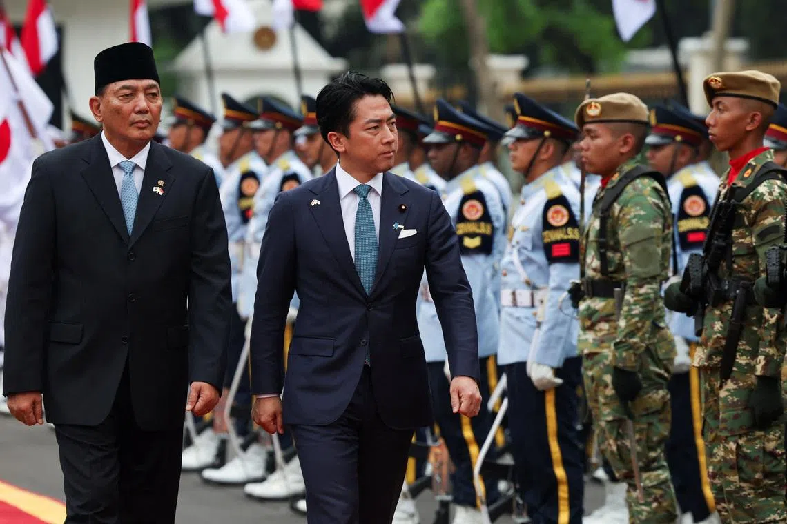 Japan's Defence Minister Shinjiro Koizumi with Indonesia's Defence Minister Sjafrie Sjamsoeddin inspects the honour guards during a welcome ceremony in Jakarta, Indonesia, May 4, 2026. REUTERS/Ajeng Dinar Ulfiana