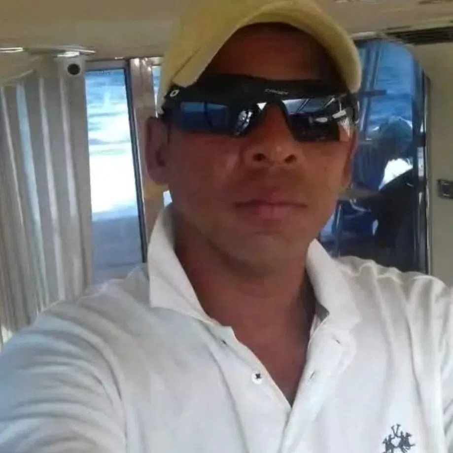 Colombian fisherman Alejandro Carranza poses for a photograph on his boat in this undated handout photograph, taken on the shore of Santa Marta, Colombia, and made available to Reuters on December 5, 2025. Daniel Kowalik/Handout via REUTERS
