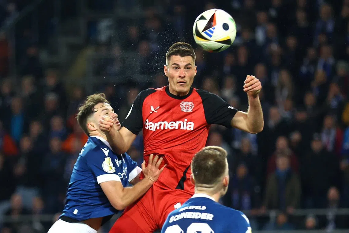 Soccer Football - DFB Cup - Semi Final - Arminia Bielefeld v Bayer Leverkusen - Bielefelder Alm, Bielefeld, Germany - April 1, 2025 Bayer Leverkusen's Patrik Schick heads at goal REUTERS/Thilo Schmuelgen
