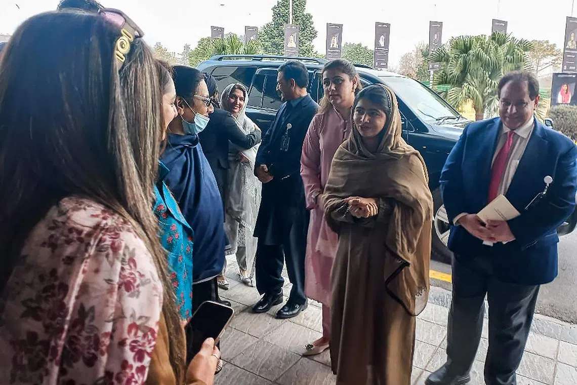 Nobel Peace Prize Laureate Malala Yousafzai (second from right) arrives to attend a global summit on girls’ education in the Islamic world in Islamabad.