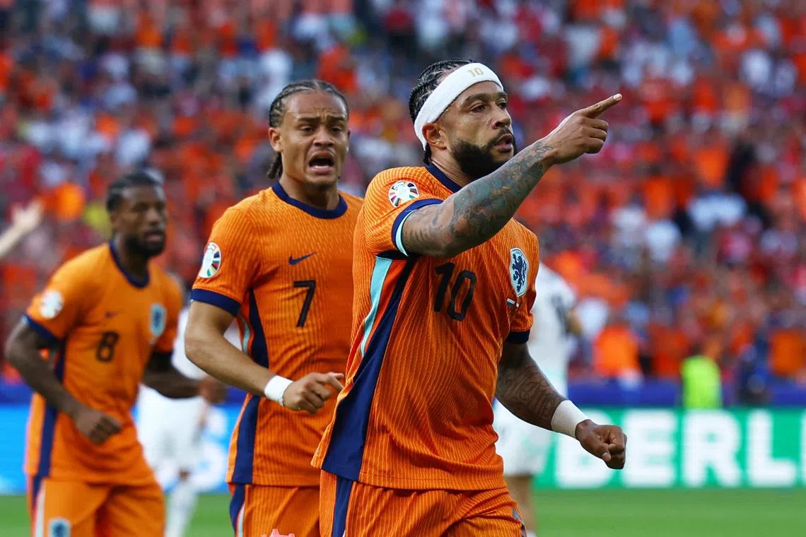 Soccer Football - Euro 2024 - Group D - Netherlands v Austria - Berlin Olympiastadion, Berlin, Germany - June 25, 2024 Netherlands' Memphis Depay celebrates scoring their second goal REUTERS/Lisi Niesner
