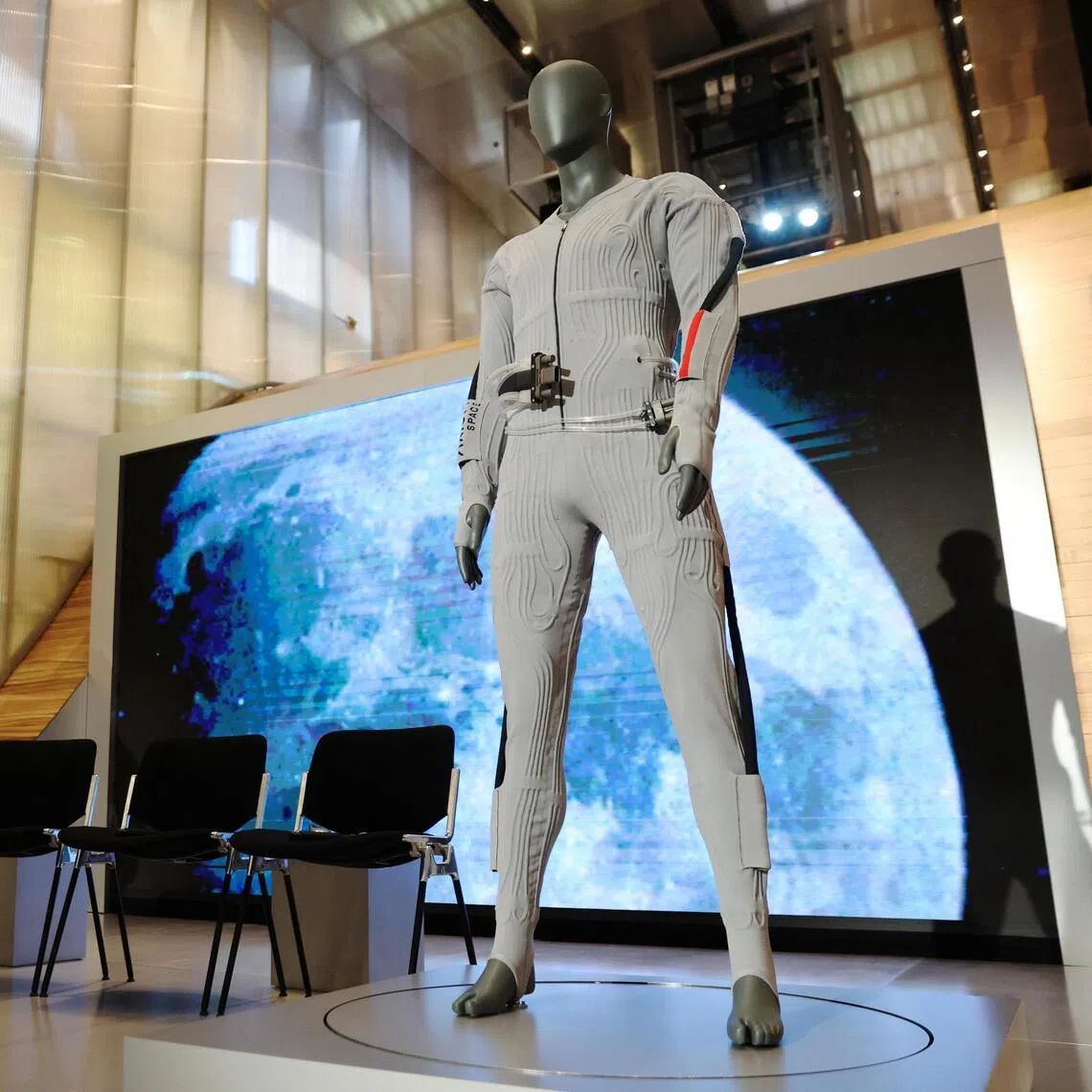 The inner-layer liquid cooling and ventilation garment designed by Prada and Axiom Space (right) was unveiled next to the spacesuit at a press event in New York City, US on June 7. 