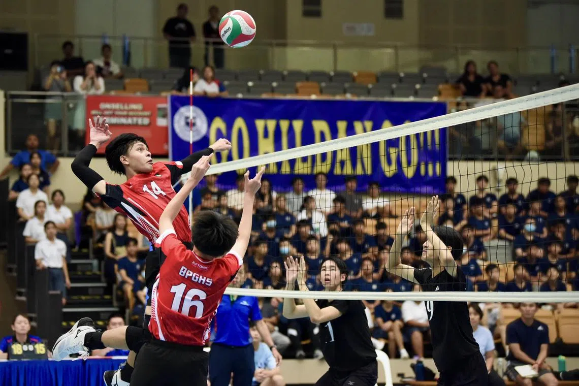 Bukit Panjang Government High School's Aariz Aydan spiking a volleyball in their B Division Boys Volleyball final loss against St Hilda's Secondary at Our Tampines Hub Sports Hall on April 16, 2024. 