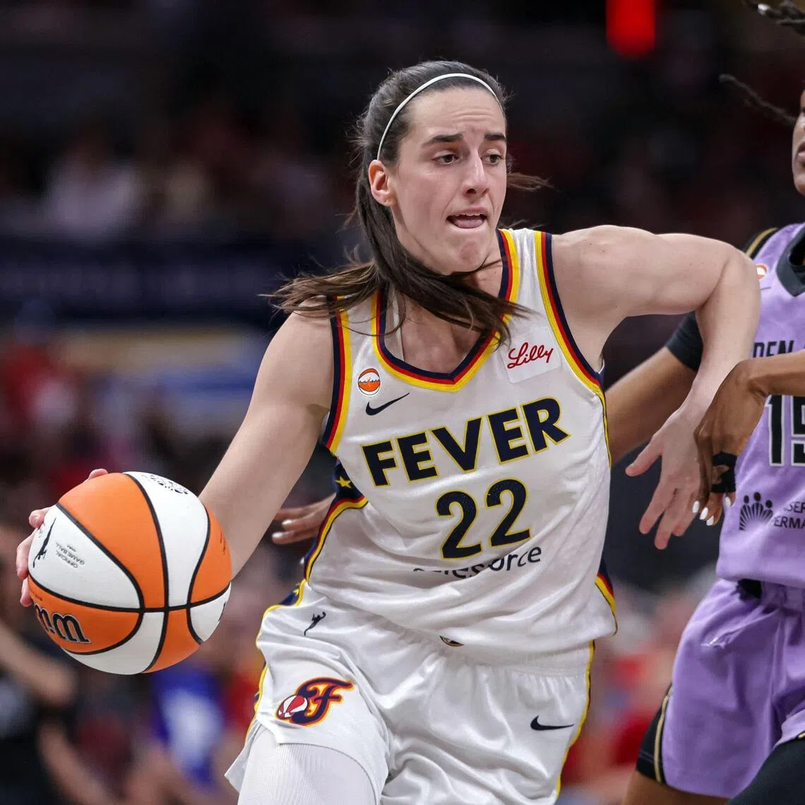 Indiana Fever’s Caitlin Clark dribbling past Tiffany Hayes of the Golden State Valkyries in Indianapolis, Indiana, on July 15.