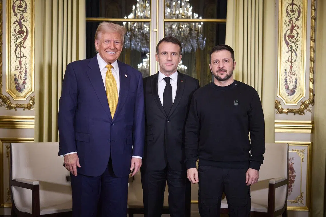This handout photograph taken and released by the Ukrainian Presidential press service on December 7, 2024, shows France's President Emmanuel Macron (C), US president-elect Donald Trump (L) and Ukraine's President Volodymyr Zelensky posing before a meeting at The Elysee Presidential Palace in Paris on December 7, 2024. Trump makes his first international trip since his election win, preparing for a day of intense diplomacy before attending the reopening ceremony for the Notre Dame cathedral restored after the 2019 fire. (Photo by HANDOUT / UKRAINIAN PRESIDENTIAL PRESS SERVICE / AFP) / XGTY / RESTRICTED TO EDITORIAL USE - MANDATORY CREDIT "AFP PHOTO /  UKRAINIAN PRESIDENTIAL PRESS SERVICE " - NO MARKETING NO ADVERTISING CAMPAIGNS - DISTRIBUTED AS A SERVICE TO CLIENTS