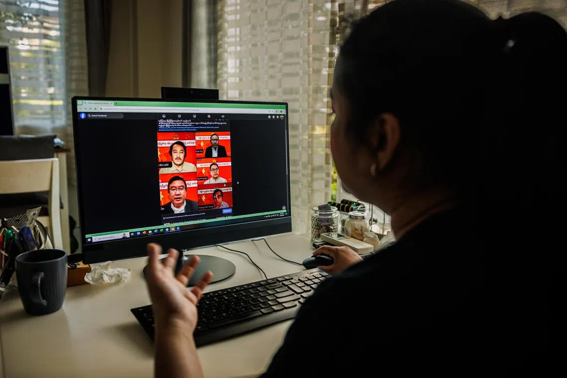 Ms Ying Lao, who runs the Salween Institute for Public Policy, a Myanmar-focused think tank, shows all-male panel posters that she has compiled on her computer. 